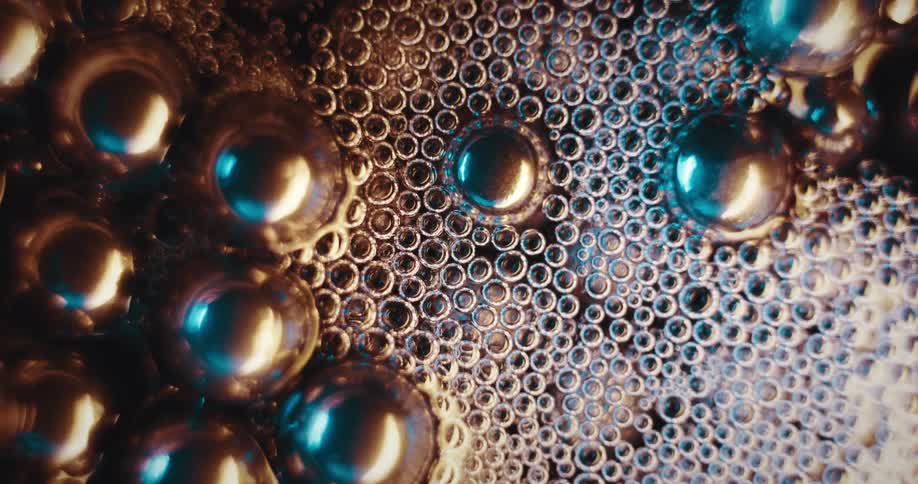 Metallic spheres in water with abstract bubbles