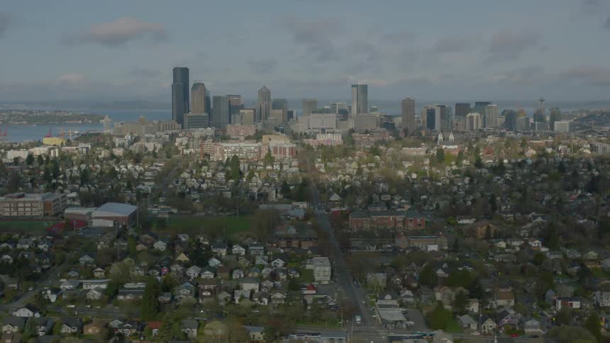 Urban neighborhoods with a city skyline and body of water