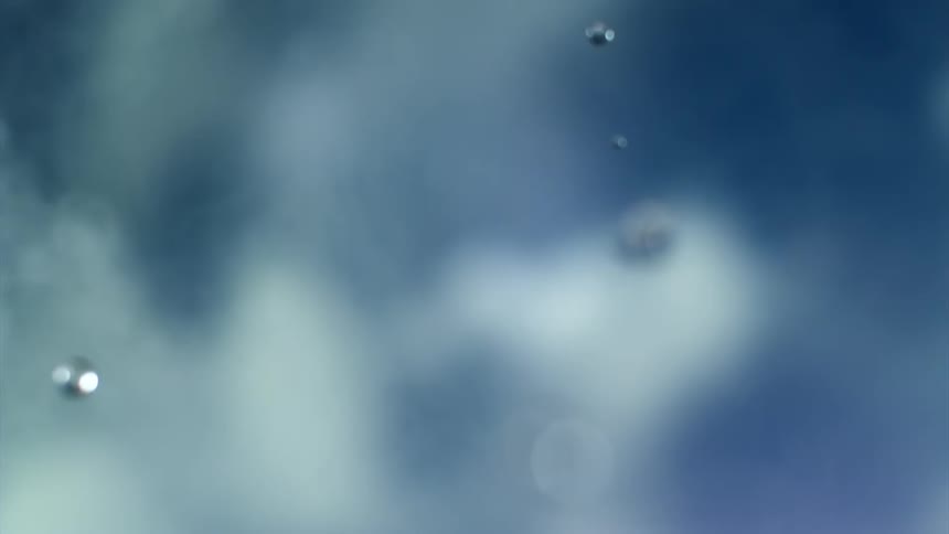 Several drops of liquid are falling as if they were rain