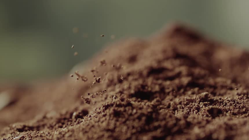 A drop of water falling on the red earth