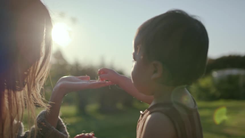 Baby picked something up and placed it on the mothers palm
