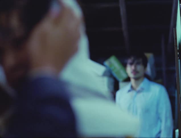 A boy is having his hair dried with a towel and behind him a wet man is breathing heavily