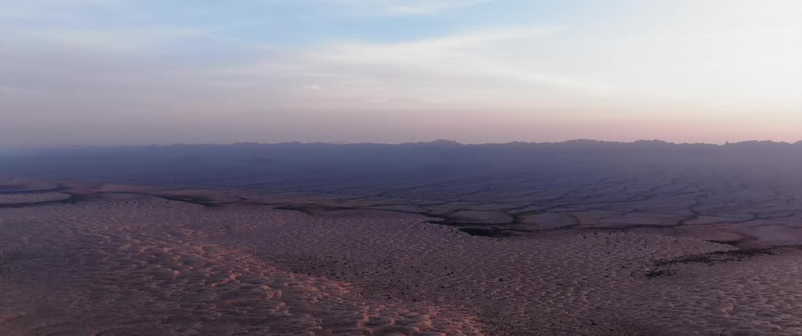 Aerial of dry desert during dusk