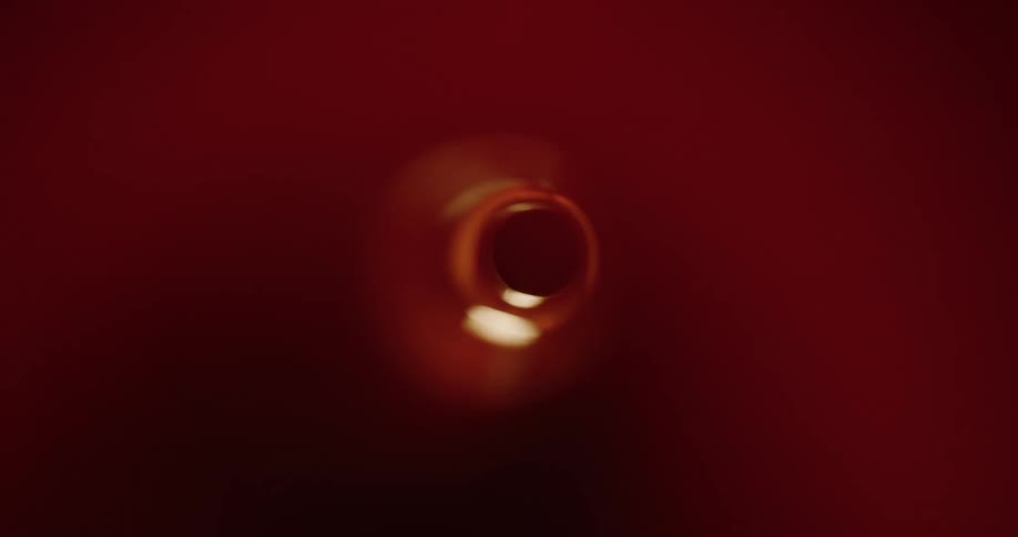 A circular shape of a tube with lights passing through
