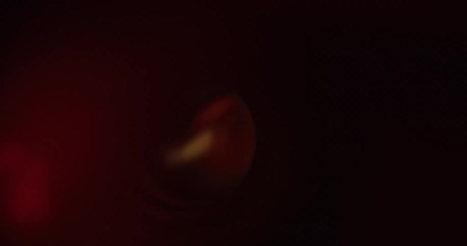 A dark space with a brief light reflection