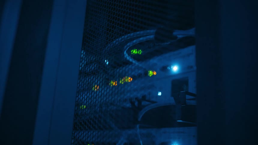 Closeup of a network server area with cables and lights