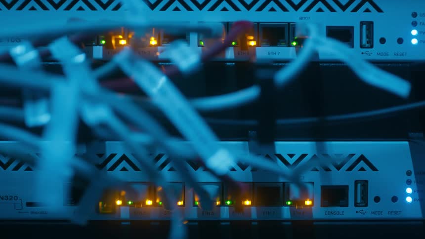 Blinking yellow lights on a control board in a dark room