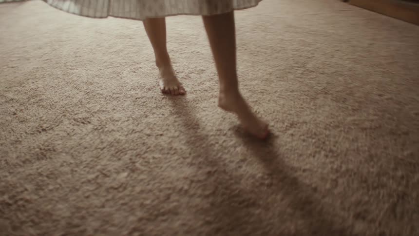 A little girl doing ballet step with her legs