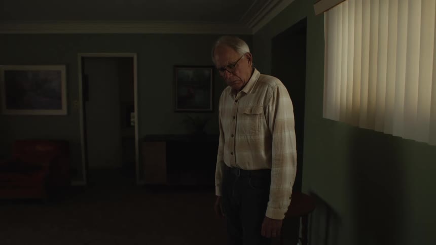 A sad man leaving the room empty