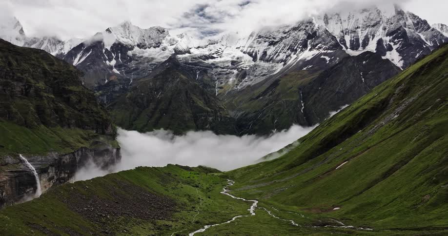 The mountain peaks are covered with snow