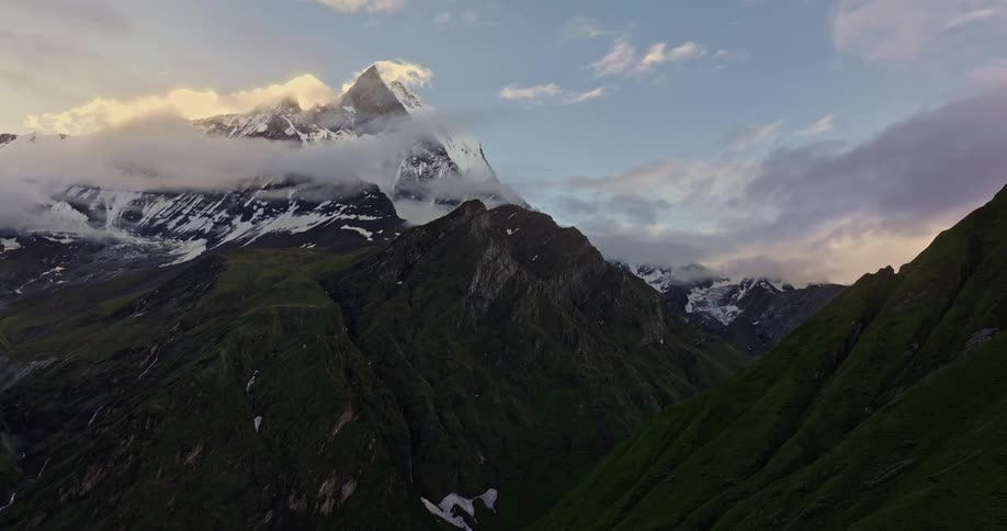 The mountains have snow at the top
