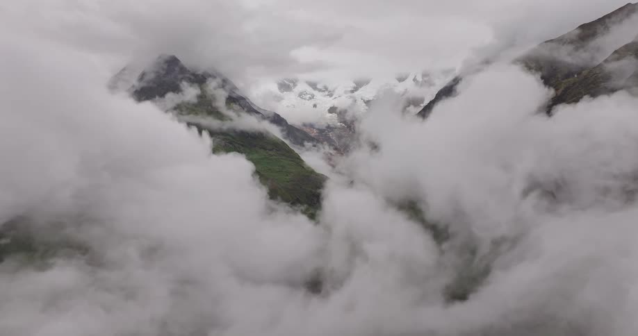 Clouds of fog surrounding mountain peaks