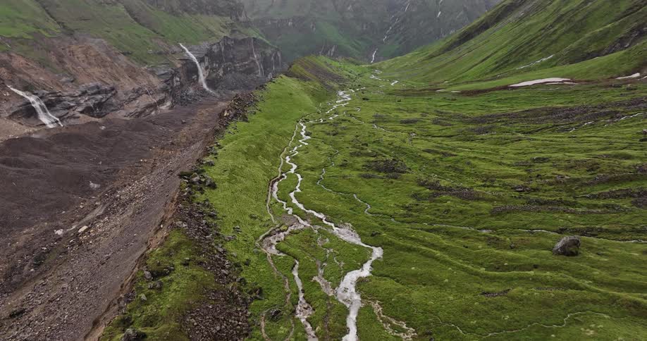 Aerial view of moss covered mountains with a gorge between them
