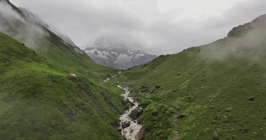 Aerial of the stream on a mountain peak