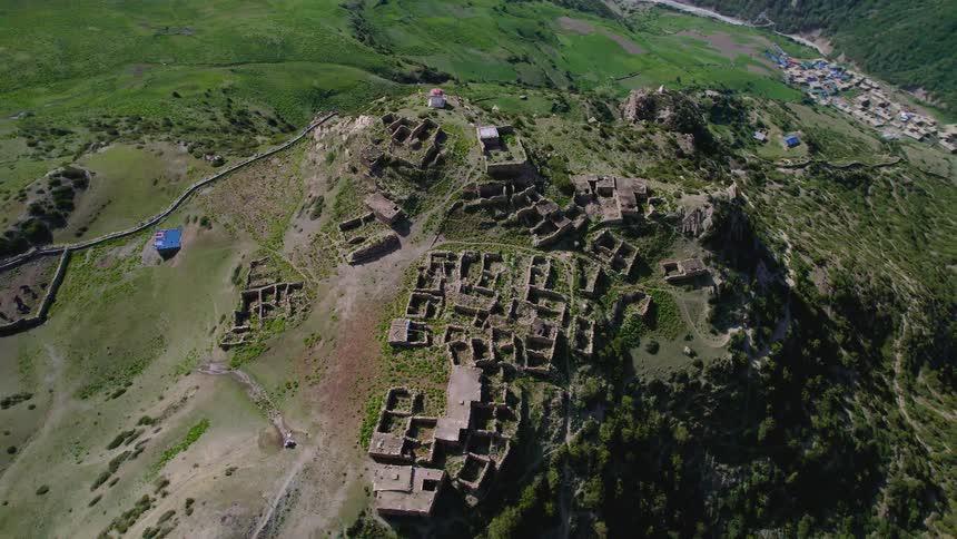 The old abandoned town sits on the hill with broken down homes