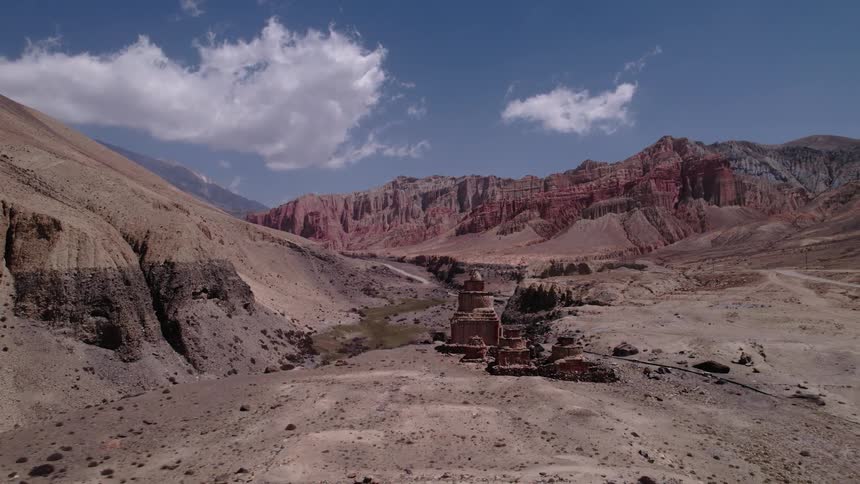 Panorama of artistic rock formations in a valley among the mountains