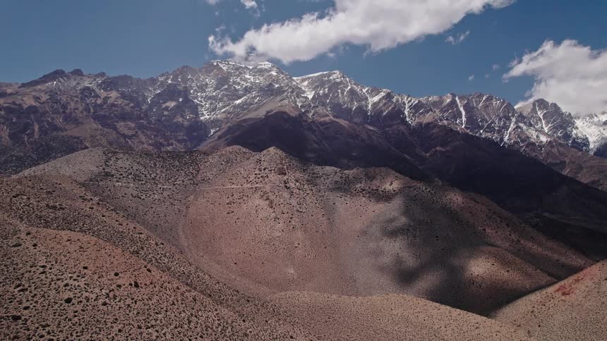 The clouds leave shadows on the mountains