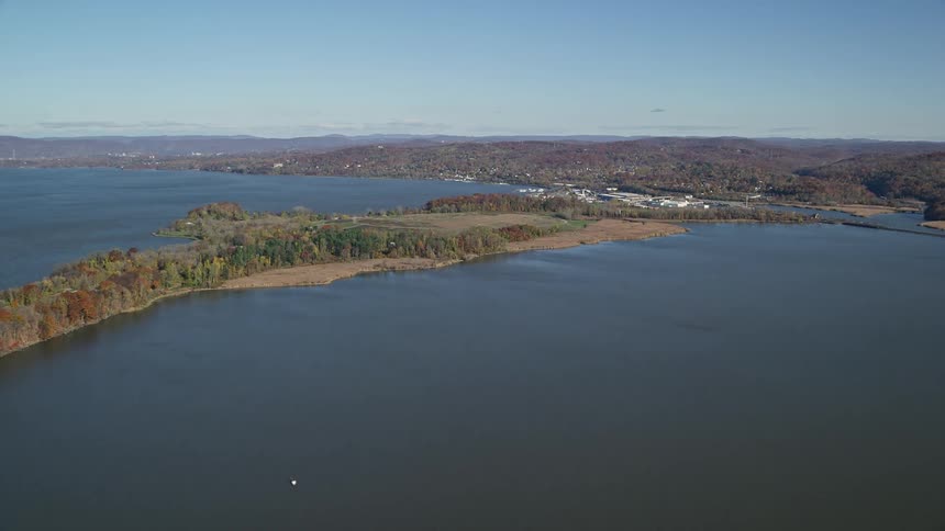 Aerial panorama of the sea with an urban city on the horizon