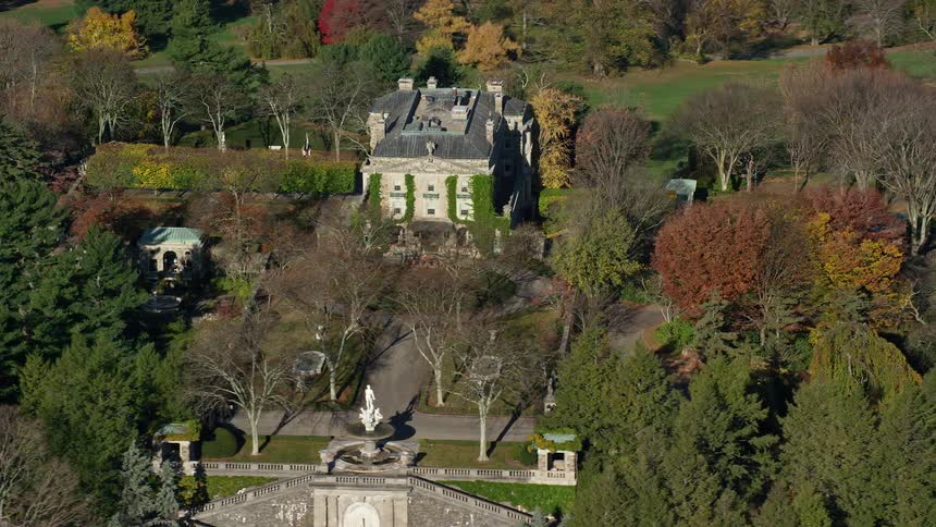 Aerial view of a mansion surrounded by nature