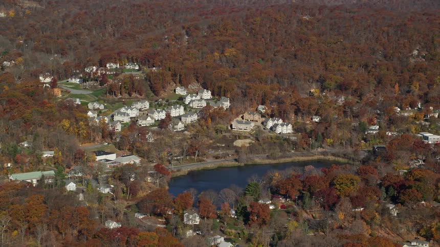Aerial view of a small community around a lake in the forest