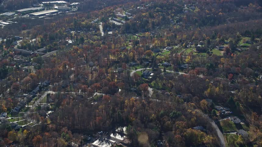 A rural region with many houses and several trees around