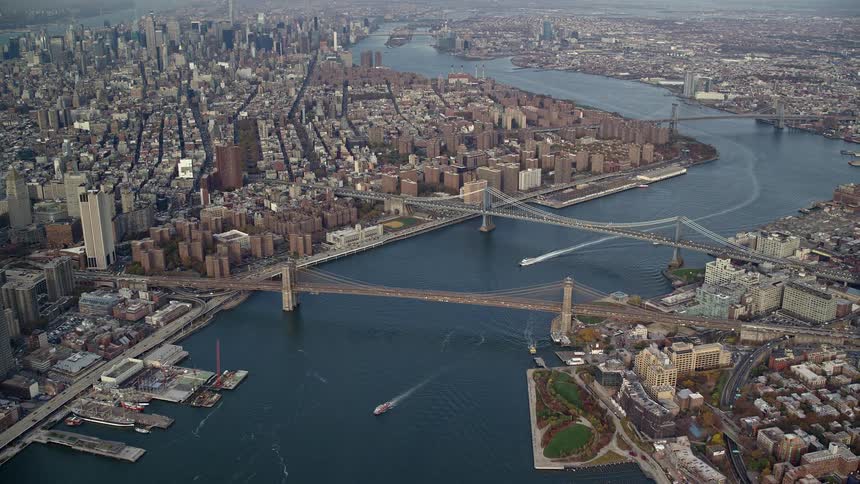 Aerial of bridges and buildings in a metropolitan area at midday