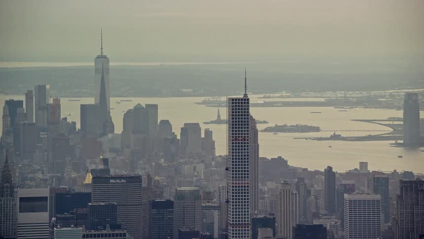 An aerial view of a metropolitan city filled with skyscrapers
