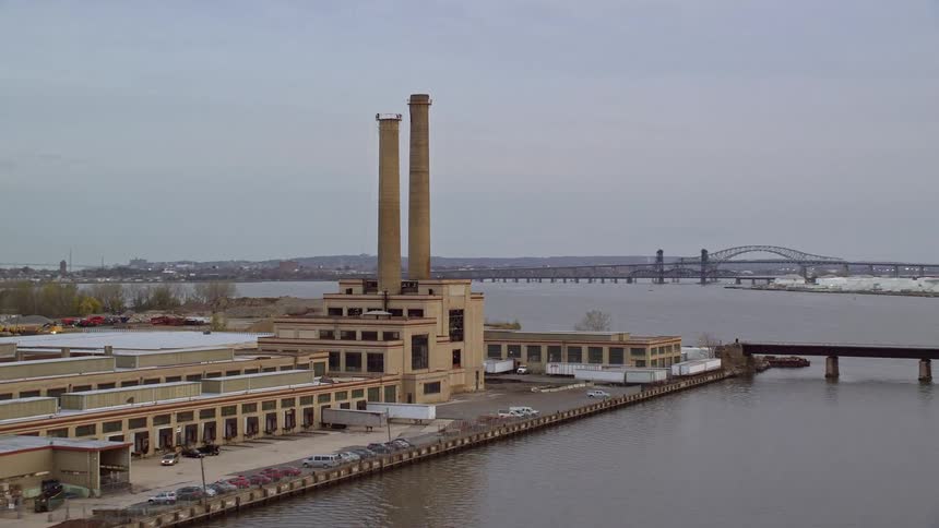 Aerial panorama of a factory by the seaside