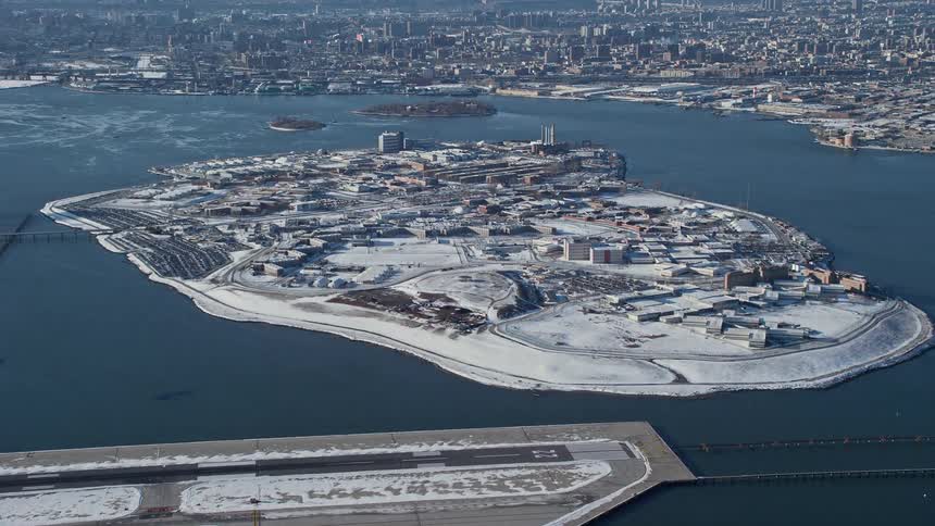 An island close to the city is filled with snow due to the winter season