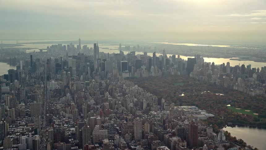 A metropolitan city and at the bottom there is a sea