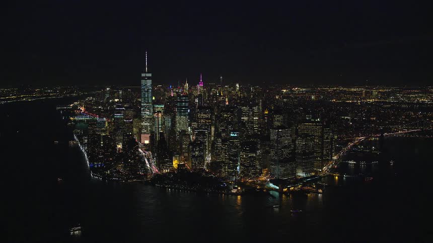 Aerial and panoramic view of a metropolis by the seaside at night