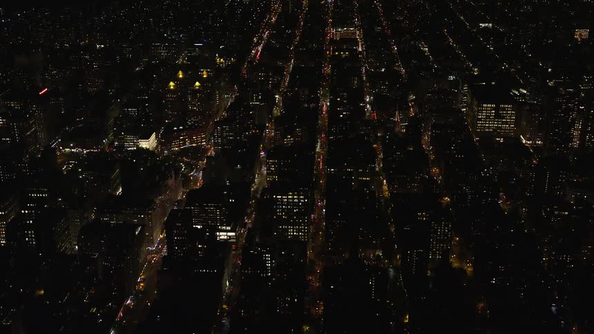 Aerial panorama of an illuminated metropolis at night
