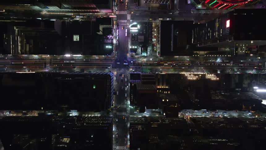 Aerial view of skyscrapers streets and nighttime traffic in a metropolis