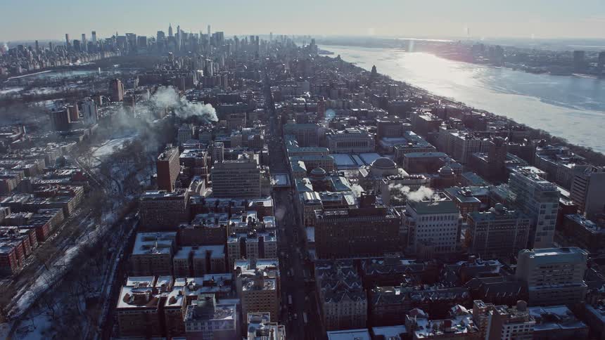 An urban region of a large city and in the background several tall buildings