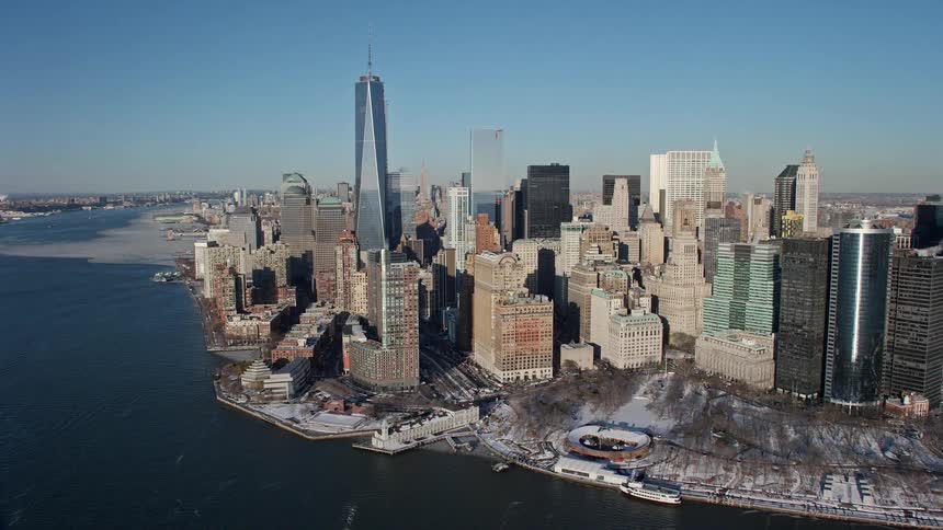 A city skyline view close to the shores with lots of high rise buildings
