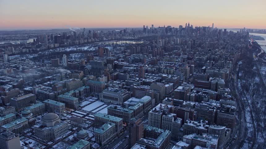 Buildings in a city at dawn