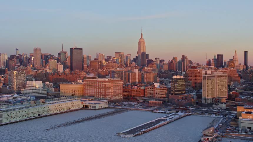 View of a metropolis by the seaside under a morning sky