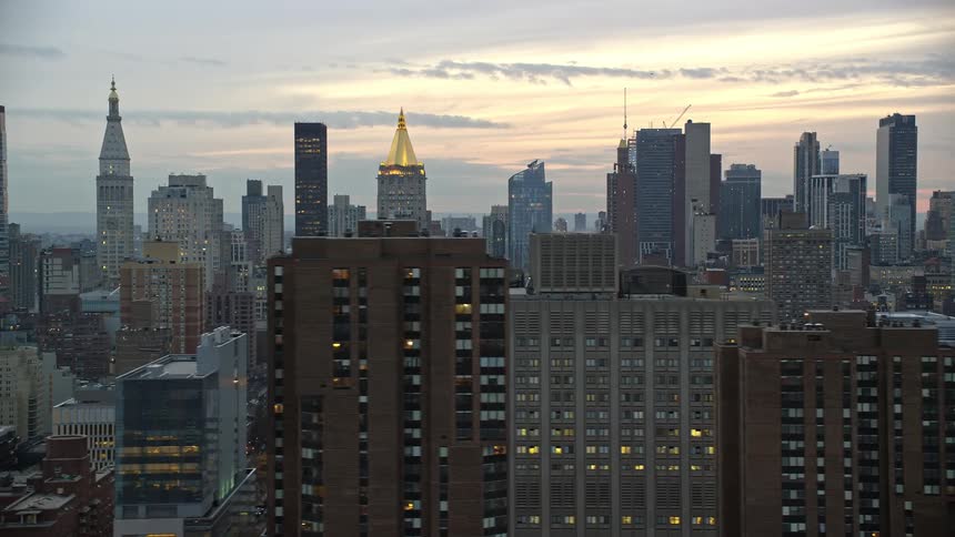 Aerial panorama of a metropolis with a dawn sky