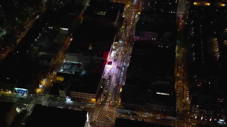 A night aerial view of a highway in a metropolis