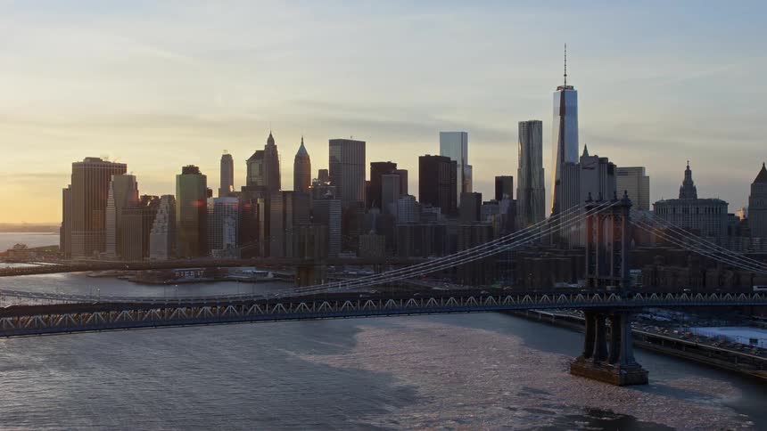 Aerial of the bridge over the sea in the city of brooklyn during sunset