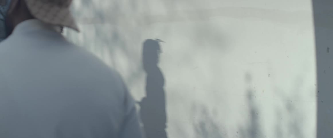 Men walking in the alley of a neighborhood in the morning