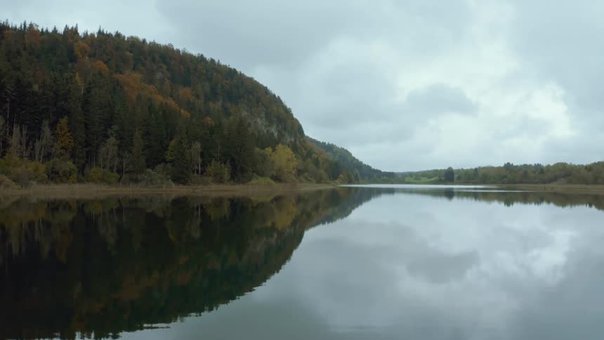 The lake is reflecting the mountains
