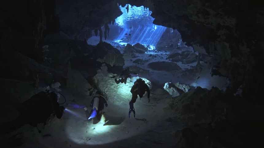 Divers inside an underwater cave