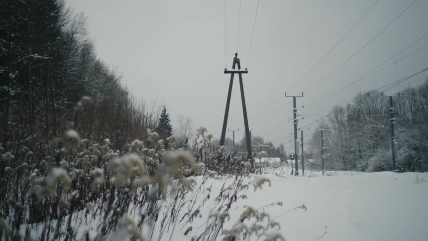 Overhead electrical cables during winter at midday
