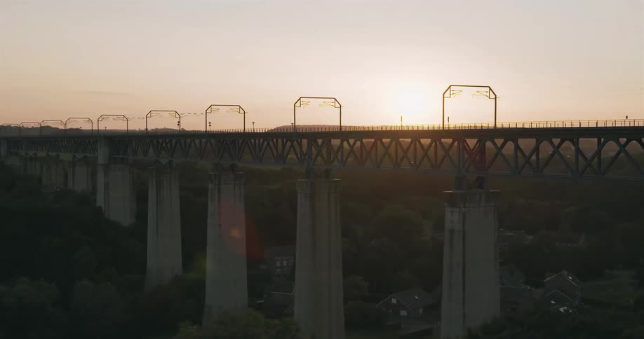 Landscape of a bridge with pillars at sunset