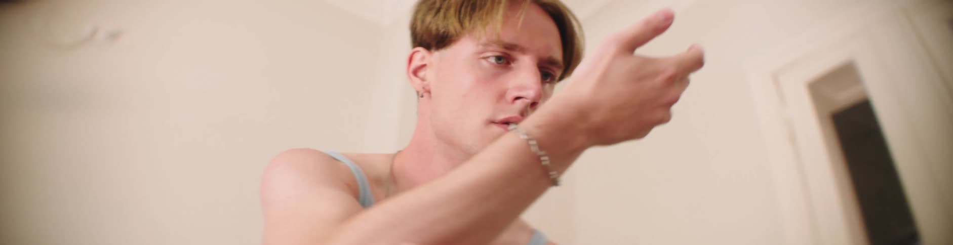Portrait of a blond man dancing