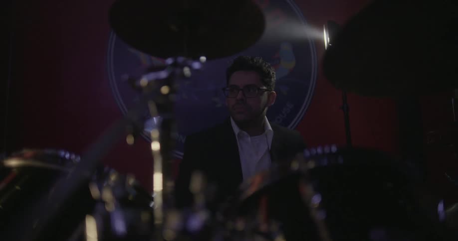 A man is playing drums
