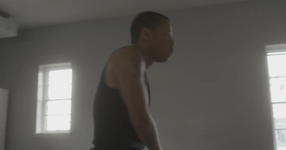 A man is dancing in a room