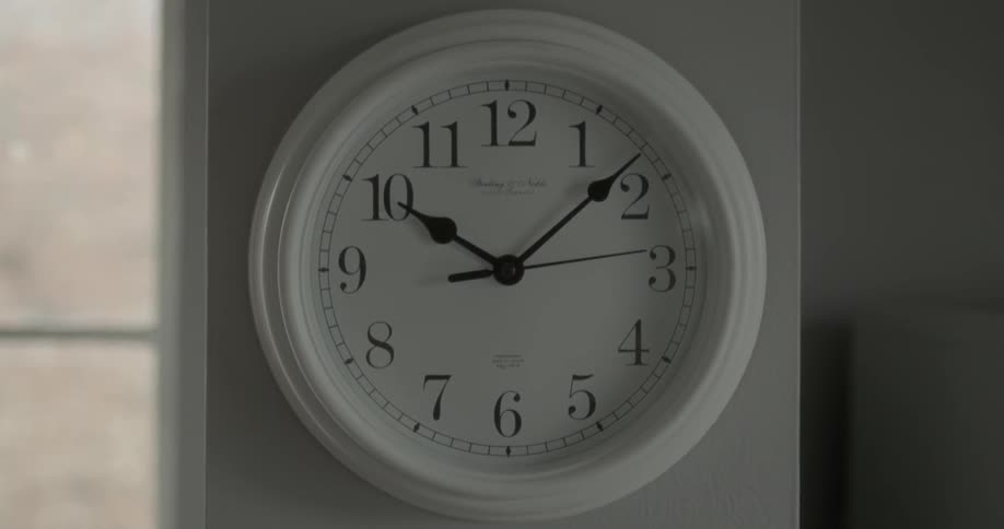 A clock on the wall is running