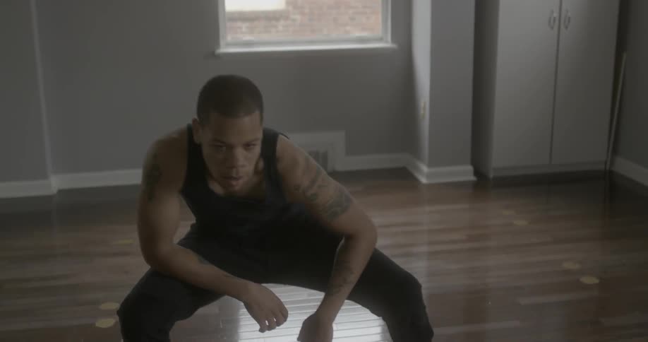 A man dances in a studio